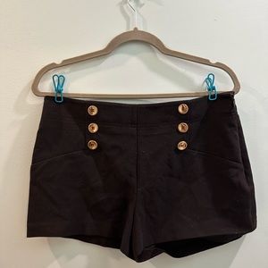 Cute shorts, zip side with metallic gold buttons - seam is falling on one side